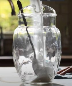 adding white sugar to prepare Texas Roadhouse Sweet Tea Recipe