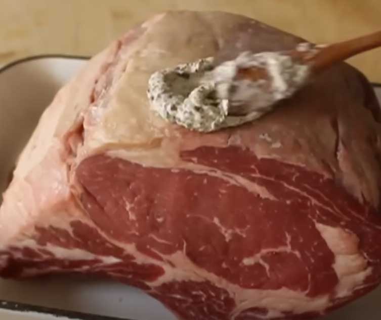 Tender Texas Roadhouse Prime Rib Sliced on a Cutting Board